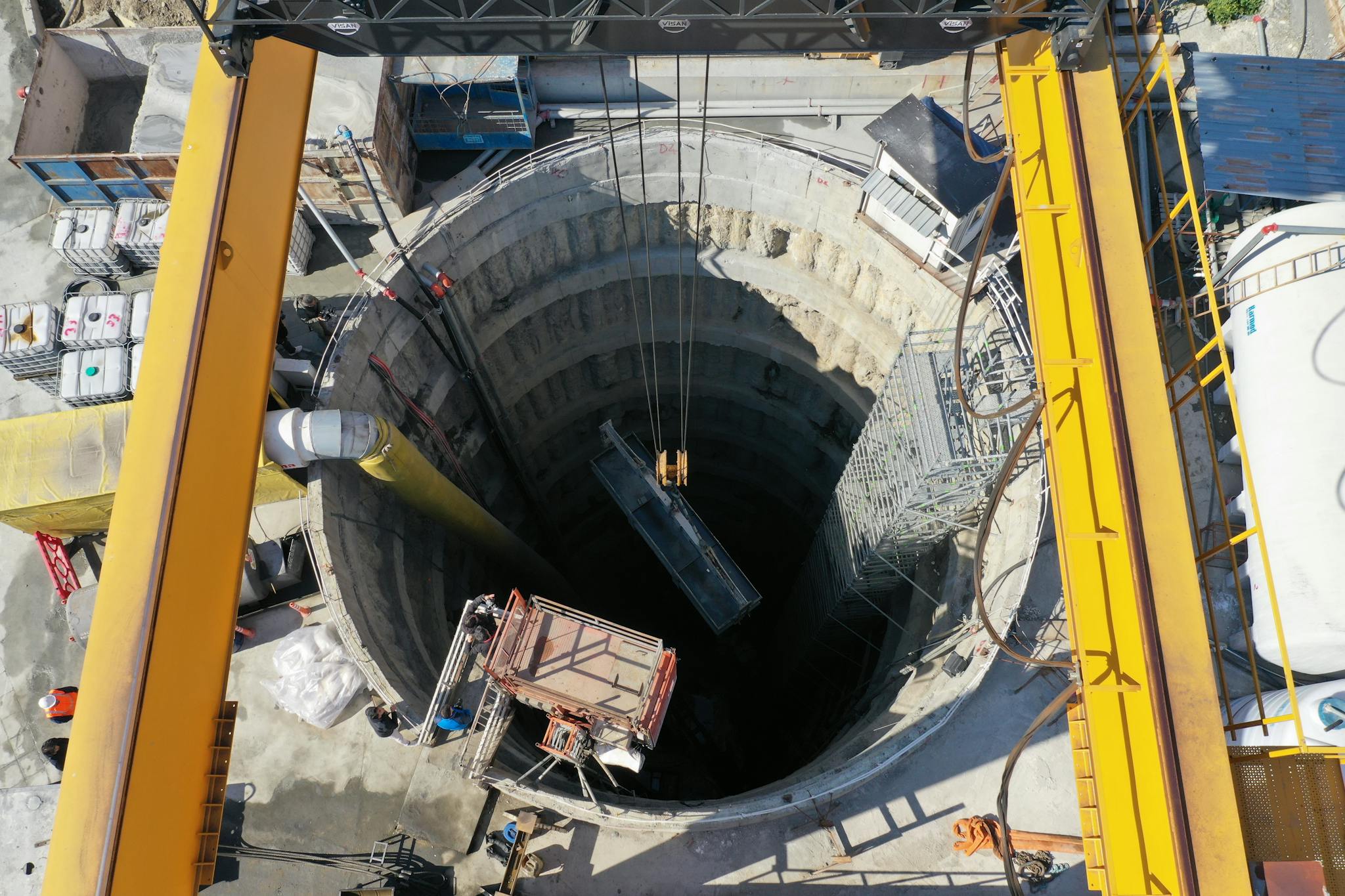 Aerial shot of a construction site featuring a large borehole with industrial equipment in Eyüpsultan, Istanbul.